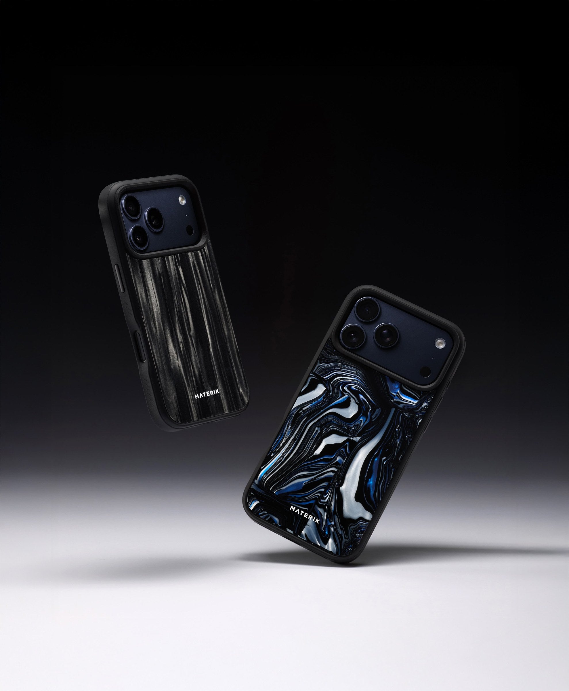 Two Materik PureCase covers for iPhone 17 Pro in dark ocean patterns, floating on a dark backdrop