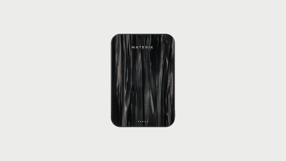 Materik Halo MagSafe Qi2 power bank in Black Pearl on a light grey background