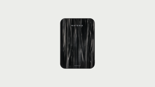 Materik Halo MagSafe Qi2 power bank in Black Pearl on a light grey background