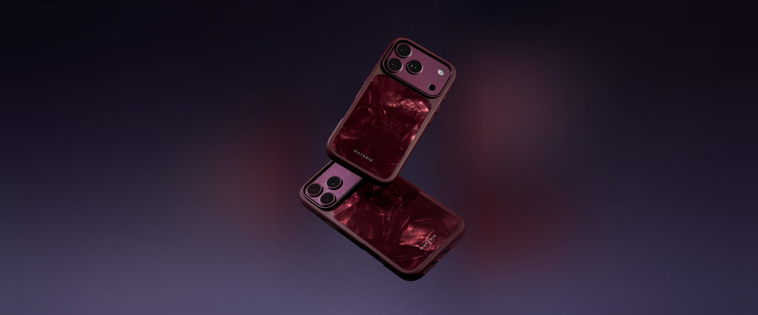 Two Materik PureCase for iPhone 18 Pro in Ruby Reef, floating on a deep purple background