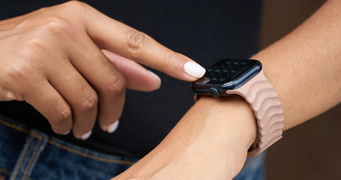 Materik Ripple Apple Watch band in sand, worn on the wrist with its sculpted wave texture