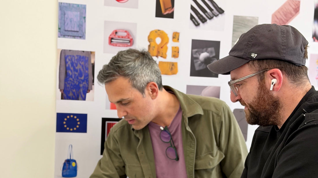 Materik designers reviewing material swatches and texture samples on a studio workbench
